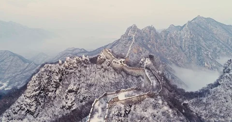 Aerial View of the Great Wall Covered with Snow under Sunset Stock Footage 121546444