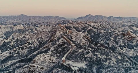 Aerial View of the Great Wall Covered with Snow under Sunset Stock Footage 121546669