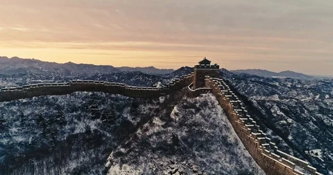 Aerial View of the Great Wall Covered with Snow under Sunset Stock Footage 121546683