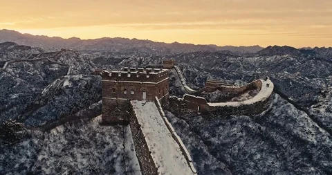 Aerial View of the Great Wall Covered with Snow under Sunset Stock Footage 121547219