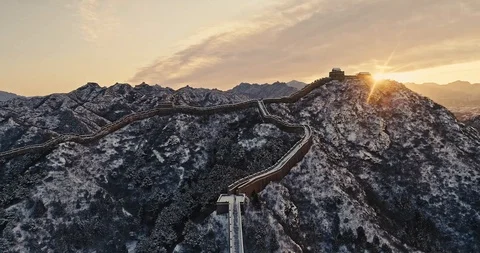 Aerial View of the Great Wall Covered with Snow under Sunset Stock Footage 121547668
