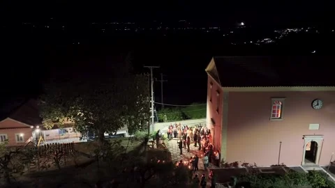 Aerial view of Greek Orthodox Easter midnight resurrection service, believers Stock Footage 333922137
