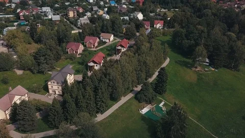 Aerial view of green fields and houses in the countryside 스톡 동영상 126041661