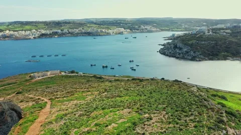 Aerial view of green fields and hills on the island, sea. Malta Stock Footage 148836629