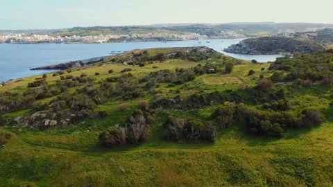 Aerial view of green fields and hills on the island. Maltese winter, blue sea Stock Footage 149030999