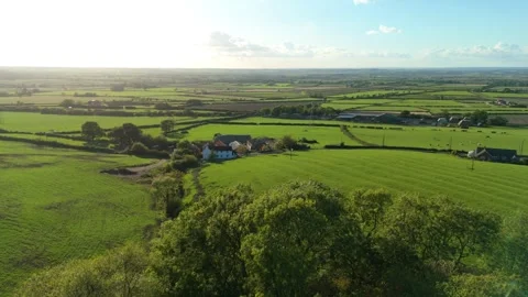 Aerial view of green fields and farms, United Kingdom. Stock Footage 318897101