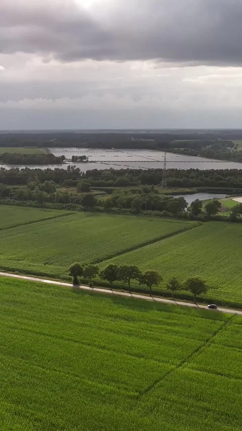 Aerial view of green fields and a flooded rural landscape Stock Footage 327109537