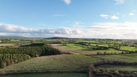 Aerial View of Green Fields and Dramatic Clouds Over Countryside 스톡 동영상 332738612