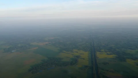 Aerial view of green fields and rural countryside landscape at hazy morning Stockbeeldmateriaal 342755402