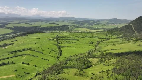 Aerial view of green fields around the Three Crowns Massif, Pieniny Mountains, Stock Footage 314044024