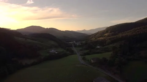 Aerial view of the green fields of the basque country at sunset, northern Spain Stock Footage 199519622
