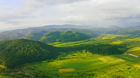 Aerial view on green fields in Carpathians Stock Footage 138778013