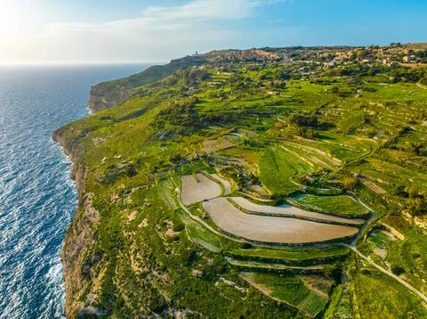 Aerial view of green fields, cliffs, hills of Malta, nature. Mediterranean sea Stock Photos