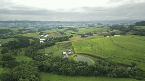Aerial view of green fields in a cloudy day. South of Brazil. 4K. Stock Footage 233105370