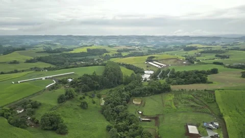 Aerial view of green fields in a cloudy day. South of Brazil. 4K. Stock Footage 233105422