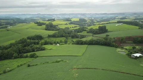 Aerial view of green fields in a cloudy day. South of Brazil. 4K. Stock Footage 233105784