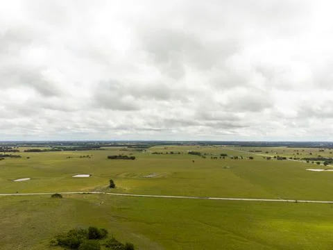 Aerial view of green fields on a cloudy day Foto stock