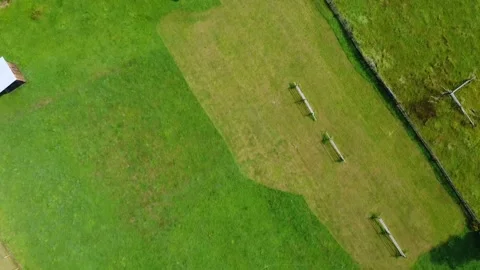 Aerial View of Green Fields with Old Wooden Barns Stock Footage 164256724