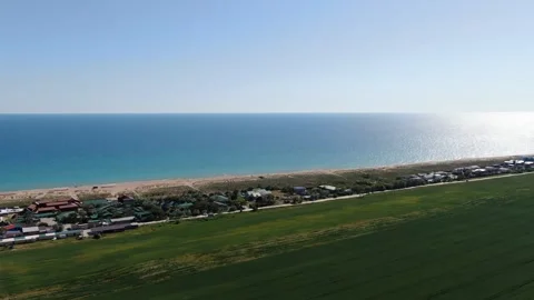 Aerial view of green fields on sea background in Krasnodar region, Anapa, Russia Stock Footage 314875982