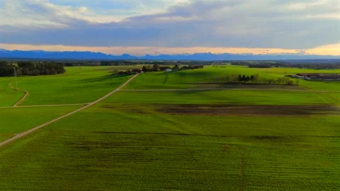 Aerial view of green fields in spring, Bavaria, Germany, showcasing sown crops Stock Footage 318977822