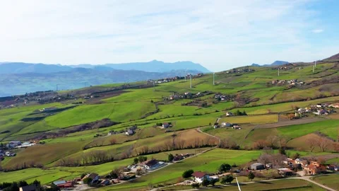 Aerial view of green fields with wind turbines, Italy. Stock Footage 326777846