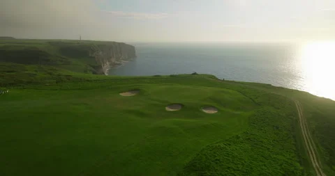 Aerial view of a green golf course located on the ocean in France. Fresh, sea Stock Footage 240507833