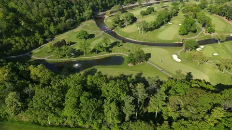 Aerial view of green golf course near residential buildings in summer.  Stock Footage 244357948