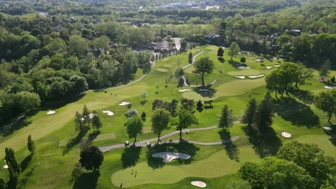 Aerial view of green golf course near residential buildings in summer.  Stock Footage 244358132