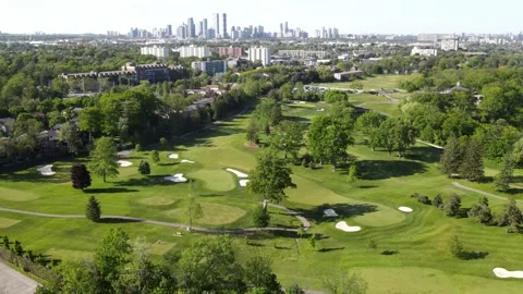 Aerial view of green golf course near residential buildings in summer.  Stock Footage 244358175