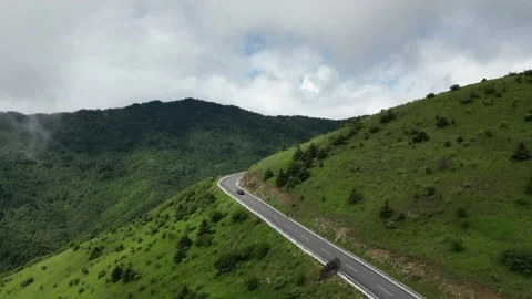 Aerial View of Green Grass Mountain Ring Road in Shennongjia Hubei China Stock Footage 337939291