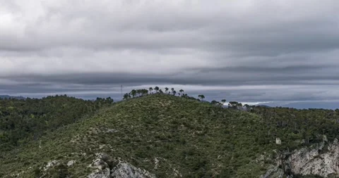 Aerial view of green mountain overlooking coastal town in Noli, Italy Stock Footage 340545579