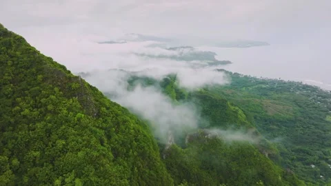 Aerial view of green mountain ridge in clouds 動画素材 345720171