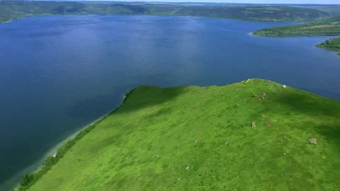 Aerial view of green mountain side near the river Video stock 160222437