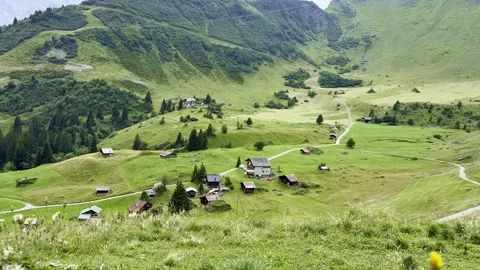 Aerial View of Green Mountain Valley with Village, Travel Landscape Vídeo Stock 345994890