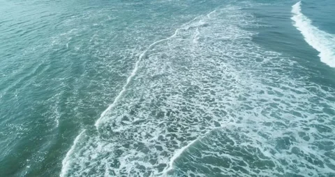 Aerial view of green ocean waves with white foam The Concept of natural energ Stock Footage 335738468