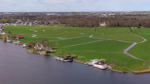 Aerial view of green polder fields divided by narrow water channels Stock Footage 336929890