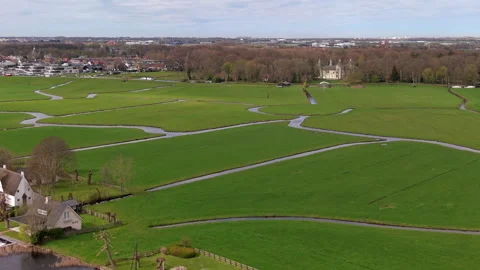 Aerial view of green polder fields divided by narrow water channels Stock Footage 336929952