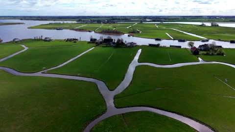 Aerial view of green rectangular fields divided by narrow water channels Stock Footage 336928911