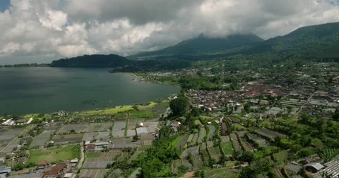 Aerial view of a green valley with fields and houses Stock Footage 275822375