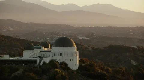 Aerial view of Griffith Observatory Los Angeles at sunrise Stock Footage