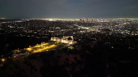 Aerial View of Griffith Observatory at Night with Downtown LA Skyline Vídeo Stock 203986491