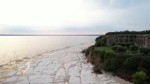 Aerial view of Grotte di Catullo on Sirmione peninsula along Garda Lake, Italy Stock Footage 220308564