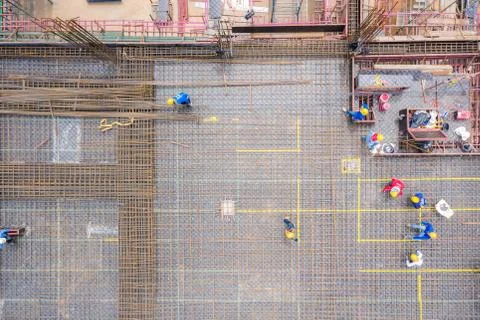 Aerial view of group of construction worker building in construction site. Stock Photos