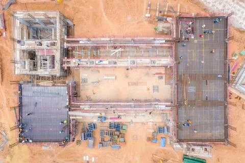 Aerial view of group of construction worker building in construction site. Stock Photos