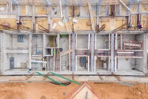 Aerial view of group of construction worker building in construction site. Stock Photos