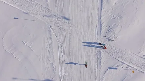 Aerial view of group exploring snowy Austrian backcountry on fatbikes Stock Footage 313366227