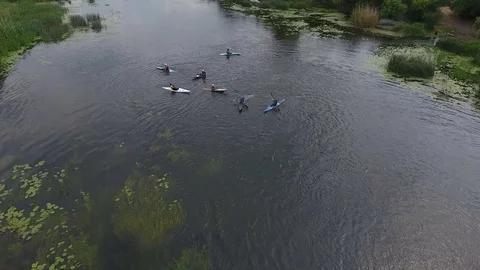 Aerial view: Group of kayakers boats on river Stock Footage 81159953