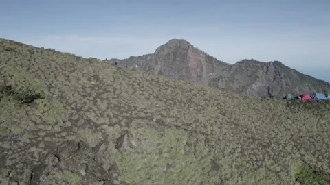 AERIAL VIEW GROUP WALKING IN MOUNT RINAJNI Stock Footage 231856930