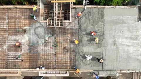 Aerial view on group of workmen making foundation on construction site. One Stock Footage 245959929
