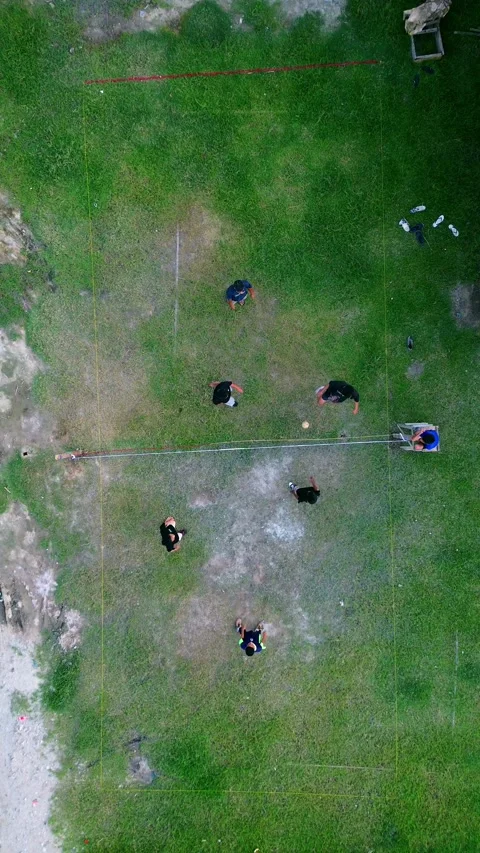 Aerial view of group of young men are playing takraw in the afternoon Stock Footage 297614927